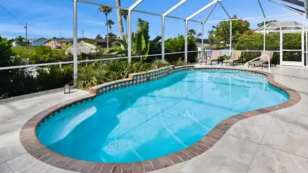 The beautifully shaped pool can be electrically heated