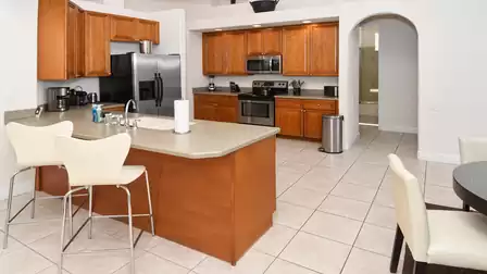 The kitchen is equipped with stainless steel electrical appliances