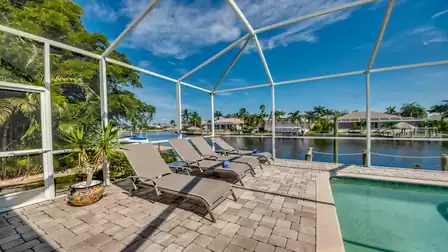 Relax on the comfortable sun loungers at Villa Donatella while enjoying a wonderful view of the water canal.