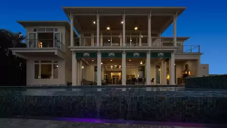 Impressive entrance of Villa River King with tropical landscaping and elegant design elements.