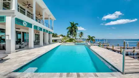Luxury villa with an infinity pool and direct river view.