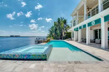 Unparalleled view from the pool deck of the serene river.