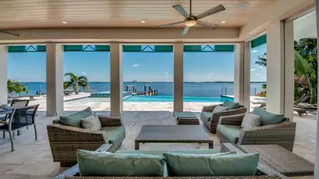 Covered terrace with a cozy lounge and spectacular view of the Caloosahatchee River.
