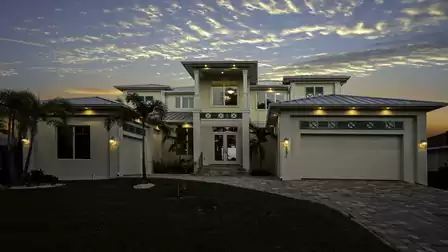 Impressive facade of the vacation home at sunset with modern lighting.