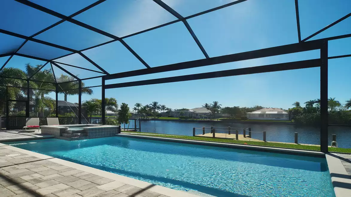 Heated pool with spa and stunning view of the wide canal.