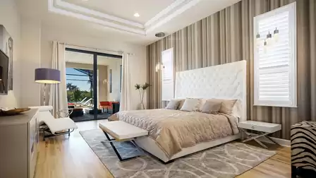 Elegant master bedroom with a luxurious king-size bed, stylish wall paneling, and direct access to the terrace.