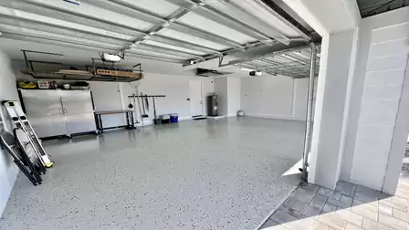 Spacious garage with ample storage and clean flooring