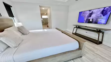Bedroom with king-size bed and bathroom access