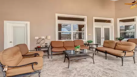Cozy seating area on the covered terrace of Villa Private Living.