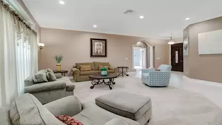 Spacious living area with stylish decor and comfortable seating.