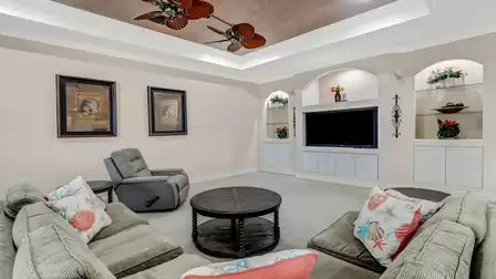 Cozy living area with a built-in TV and stylish decorative elements.