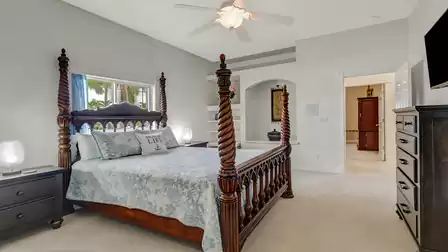 The bright and inviting atmosphere of the master bedroom is highlighted by elegant details and soft lighting.