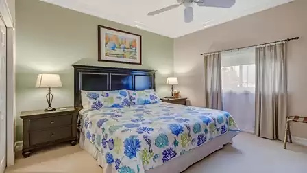 The tastefully furnished guest room offers a restful night's sleep with its comfortable king-size bed.