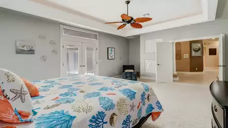 Expansive master bedroom with modern design, direct terrace access, and a relaxing ambiance.
