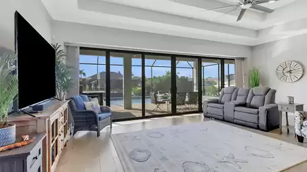 The floor-to-ceiling windows allow plenty of sun and light into the room