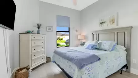 The second bedroom not only boasts a great view of the well-kept driveway, but also a...