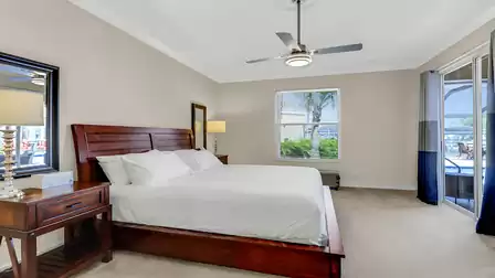 Master bedroom with king size bed and access to the terrace