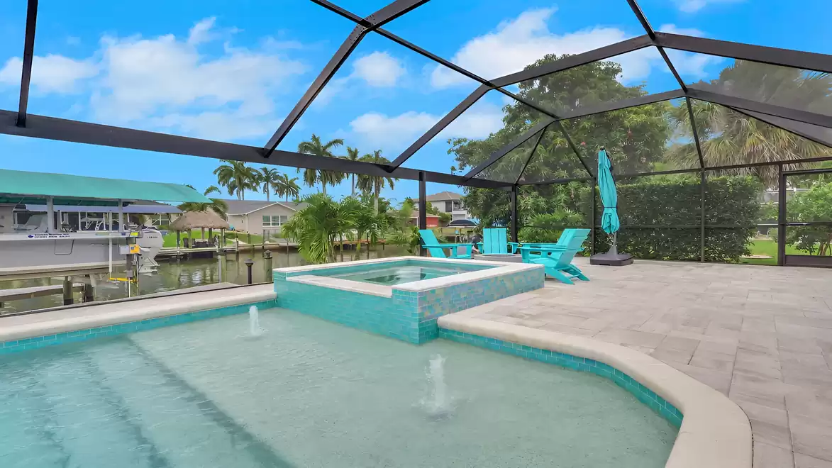 Villa Kamala in Cape Coral with a pool, spa, and screened patio overlooking the canal.