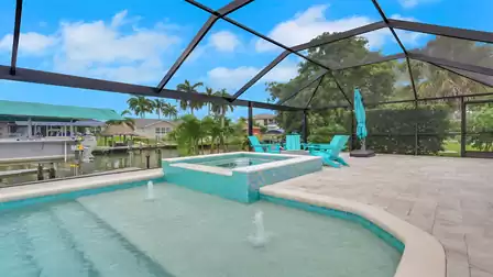 Villa Kamala in Cape Coral with a pool, spa, and screened patio overlooking the canal.