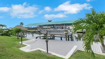Boat lift at Villa Kamala in Cape Coral with a private dock on the canal.