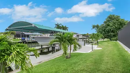 Boat lift and private dock at Villa Kamala in Cape Coral on the canal.