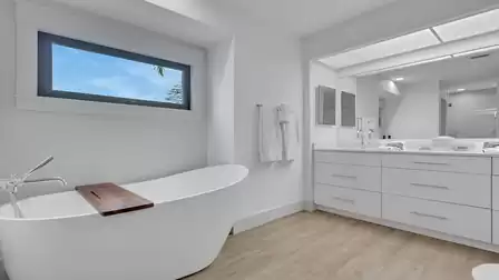 Elegant bathroom with a freestanding bathtub, double vanity, and plenty of natural light.
