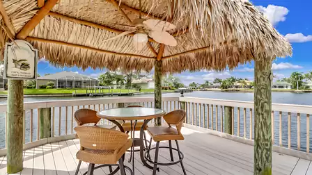 A charming tiki right by the boat dock invites you to enjoy cool drinks