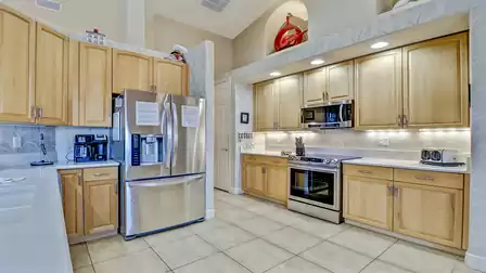 The stylish kitchen is equipped with state-of-the-art appliances