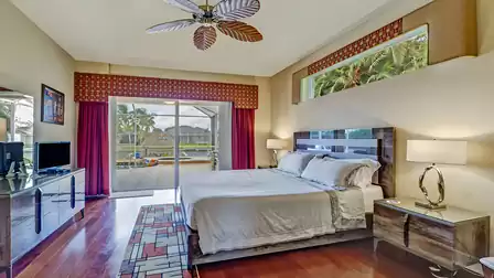 The master bedroom tempts you to sweet dreams in the oversized double bed