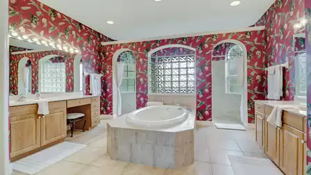 The picturesquely designed bathroom offers enough space for the whole family