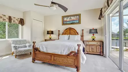 The second bedroom is flooded with natural light and leads out onto the terrace