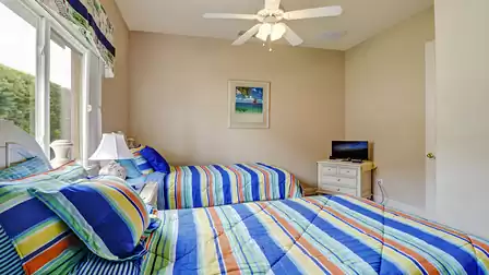 Two cozy single beds await you in the third bedroom