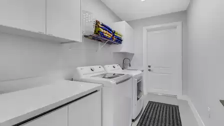 The utility room has a washer and dryer ready for you