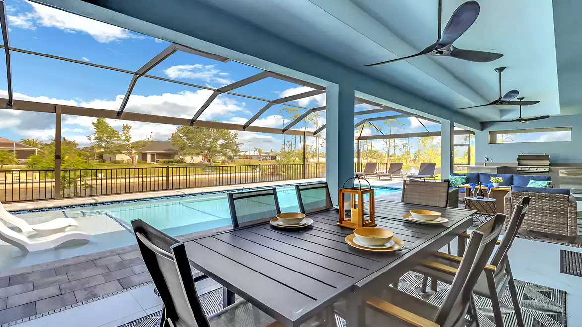 Modern dining table with space for six people on the covered terrace