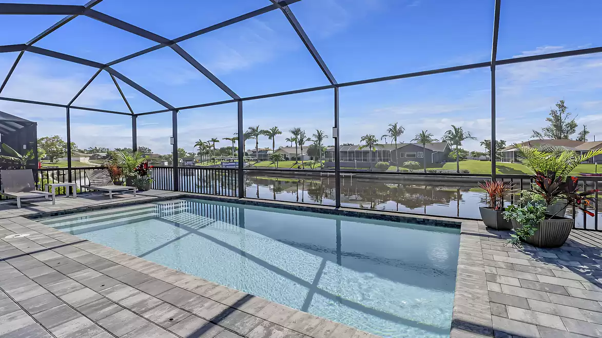 The sparkling water of the pool reflects the light and creates an inviting atmosphere