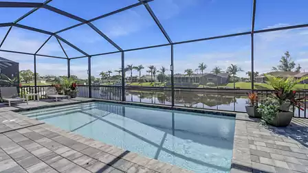 The sparkling water of the pool reflects the light and creates an inviting atmosphere
