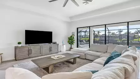 The comfortable sofa invites you to relax with its soft cushions
