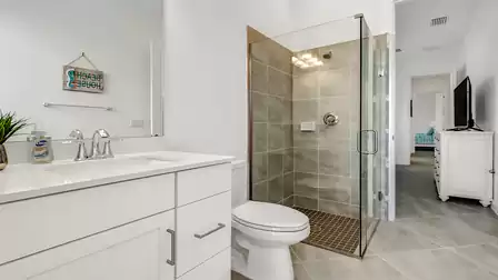 This bathroom offers a harmonious connection to the adjoining bedroom