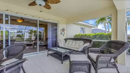Cozy lounge on the covered patio with direct access to the pool.