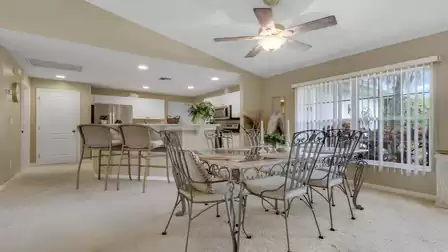 Open dining area with a kitchen island and a cozy dining set.
