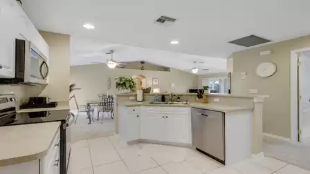 Open kitchen with ample counter space overlooking the living and dining area.