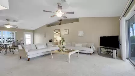 Spacious living area with comfortable sofas and an open dining area.