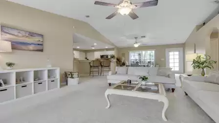 Open living area with a cozy seating area overlooking the kitchen and dining space.