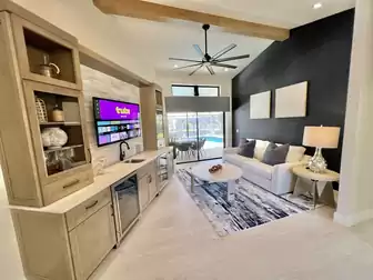 Living area with TV and fridge for drinks