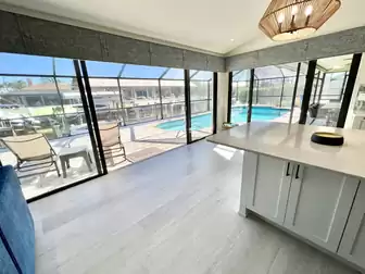 Direct access from the kitchen to the outdoor terrace and pool