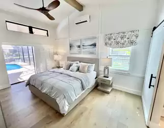 The bedroom has direct access to the pool