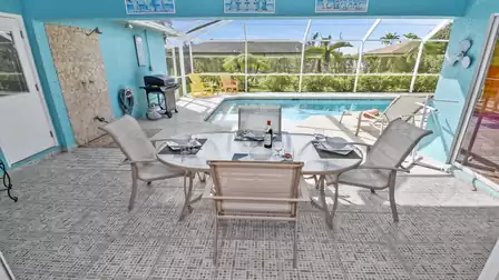 Cozy dining table on the covered terrace for six people
