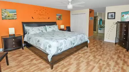Light-flooded master suite with king-size bed