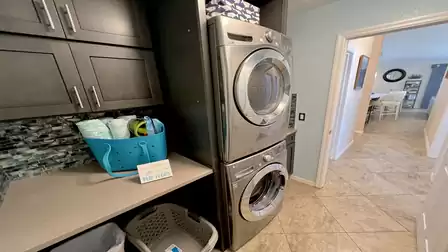 With functional appliances and generous work surfaces, this room offers everything you need for efficient laundry care