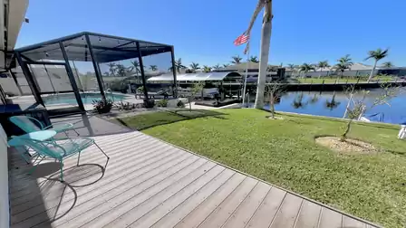 A charming little sitting area that offers a picturesque view of the canal and the adjacent boat deck